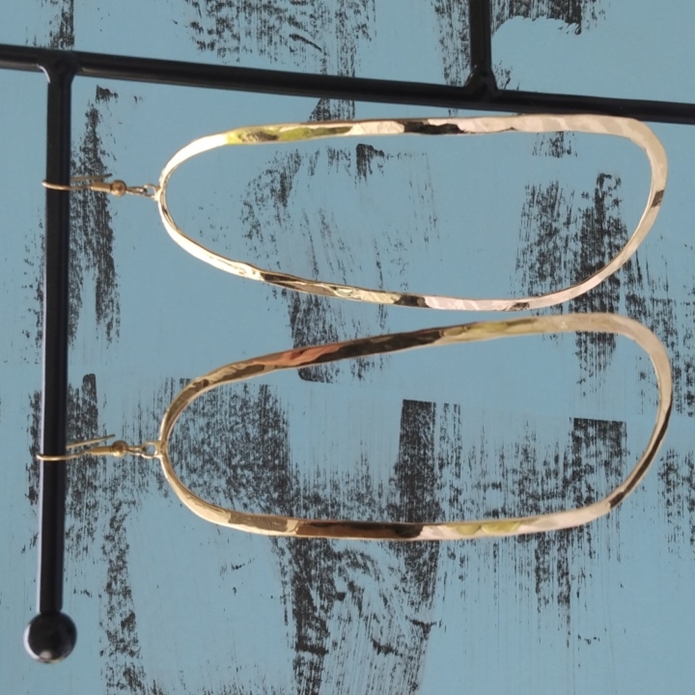 A set of long hoop Gold earrings
